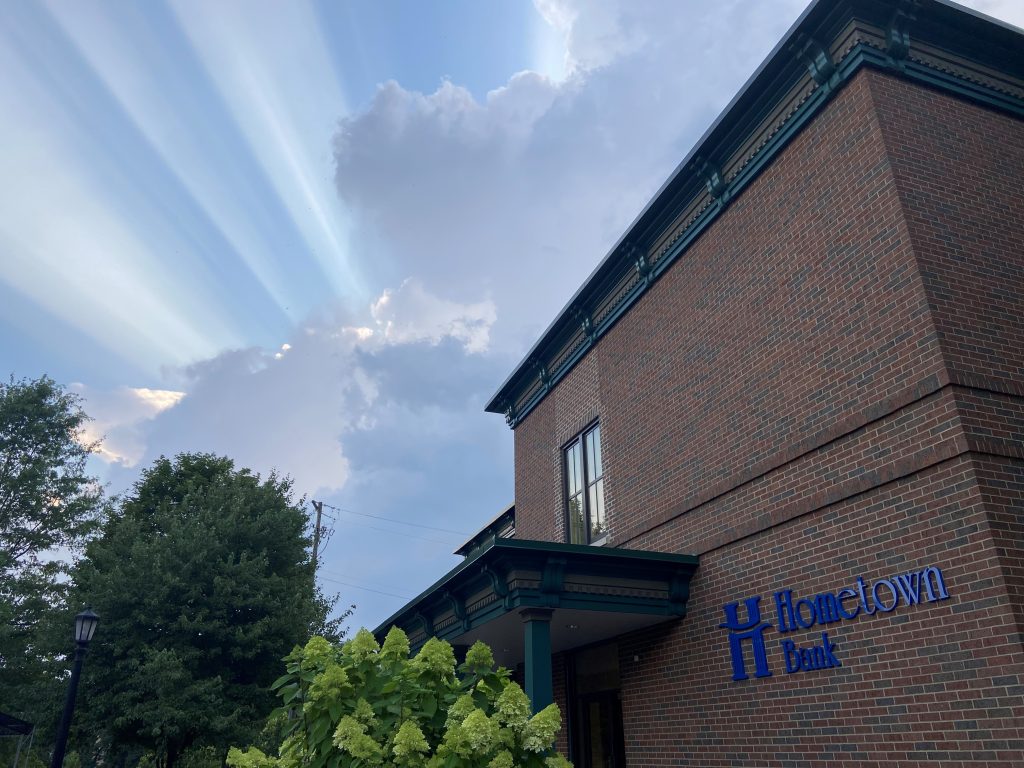 Sunrays above Hometown Bank building